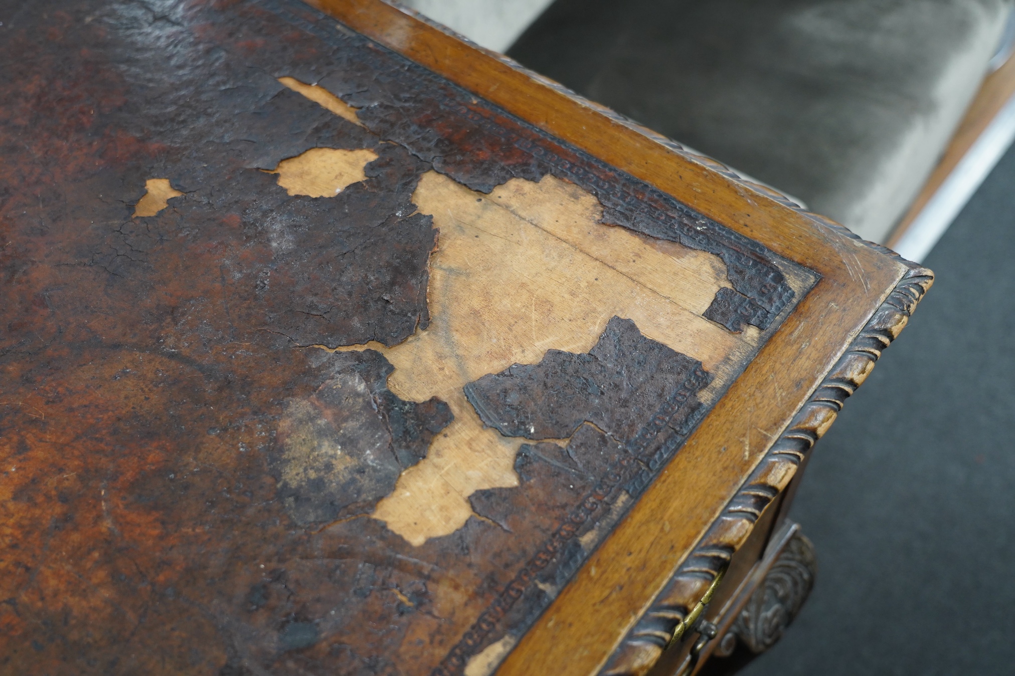 An early 20th century Chippendale Revival mahogany kneehole writing table, width 136cm, depth 75cm, height 76cm. Condition - fair, leather poor
